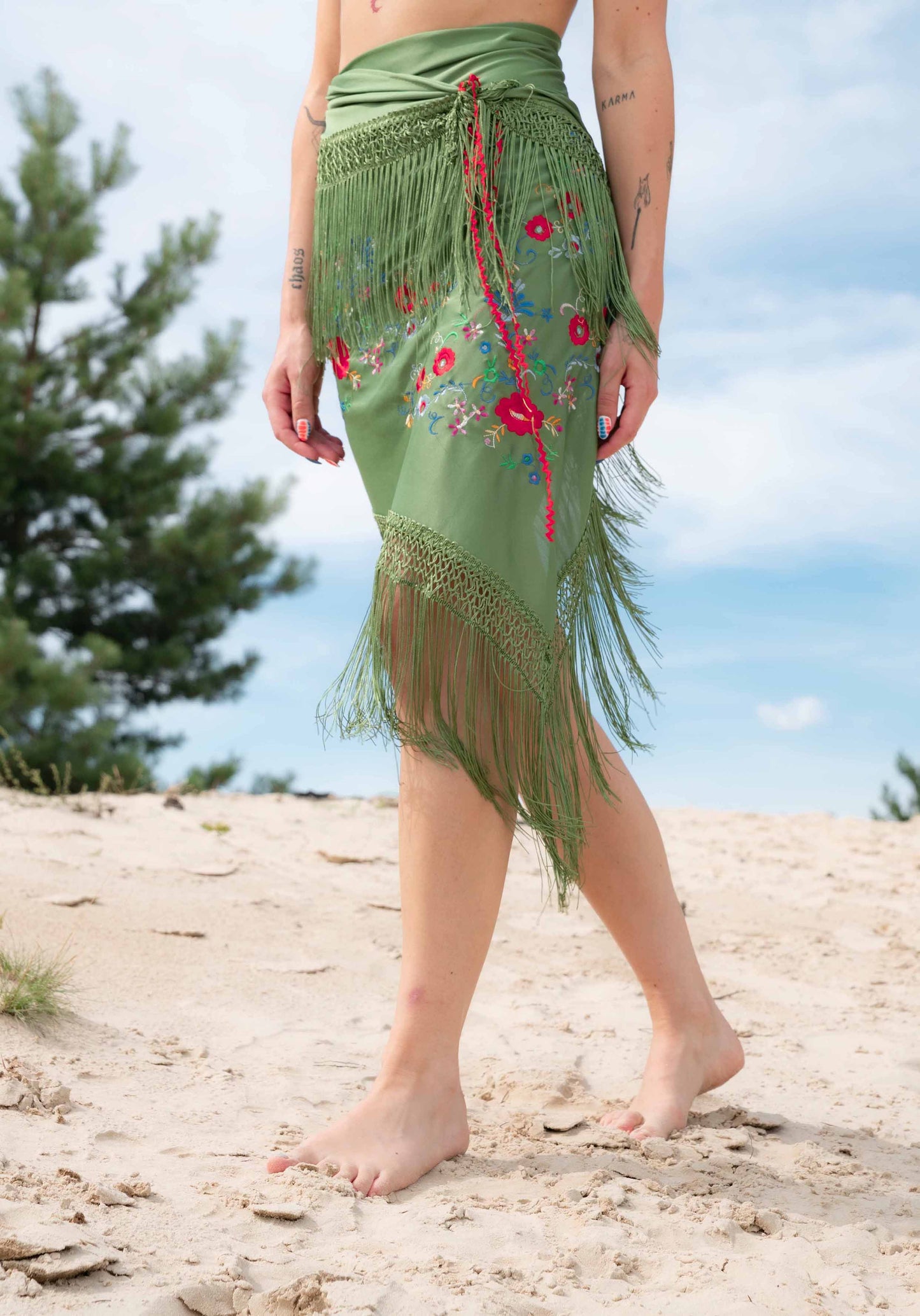 Wrap skirt with fringe and embroidered flowers