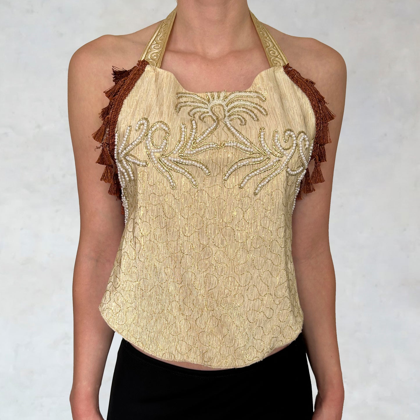 Top with embroidered ornamental motifs