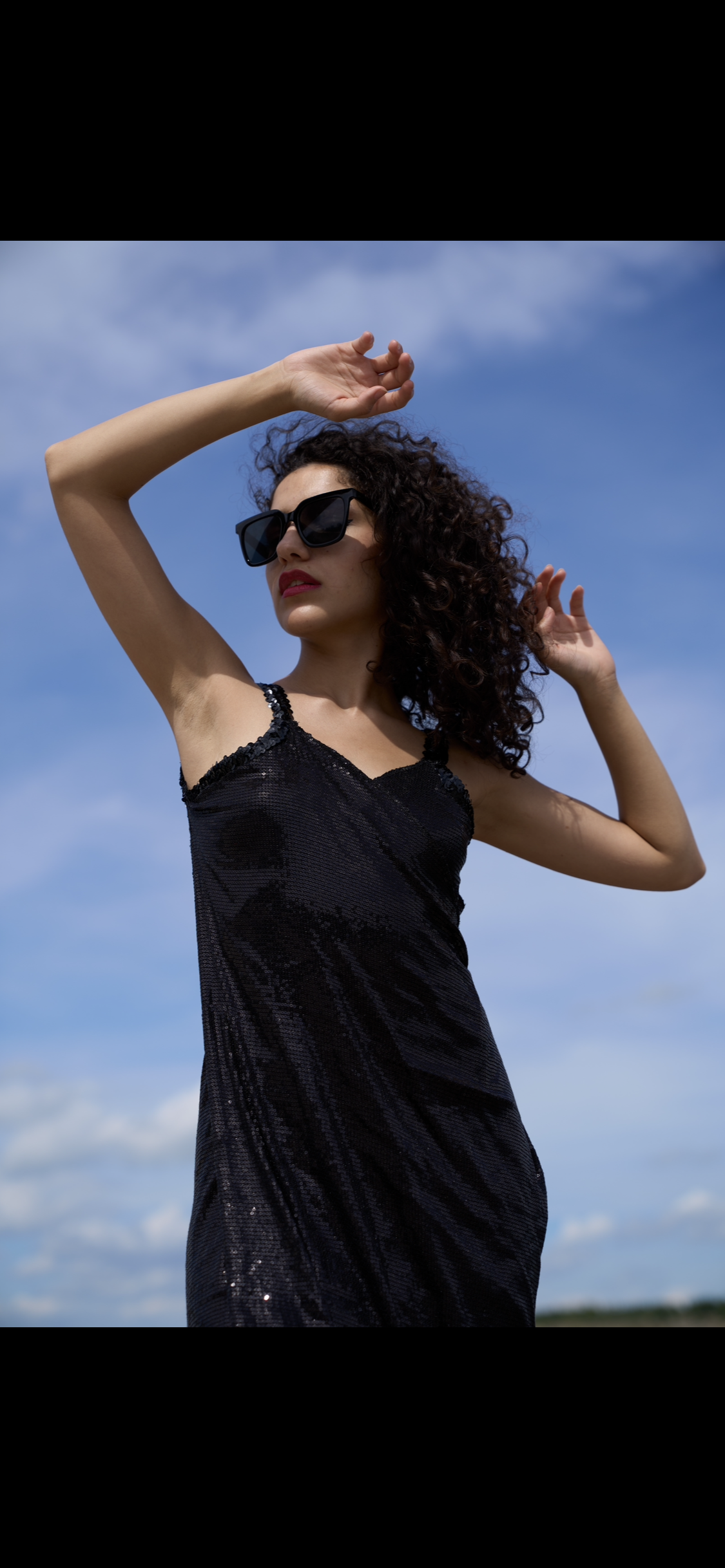 Wrap dress in black sequined fabric