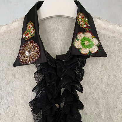 Slightly transparent shirt with ruffles and embroidery