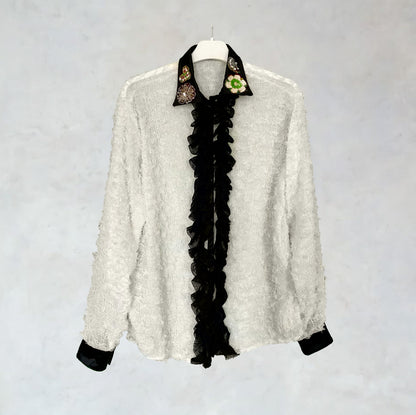Slightly transparent shirt with ruffles and embroidery