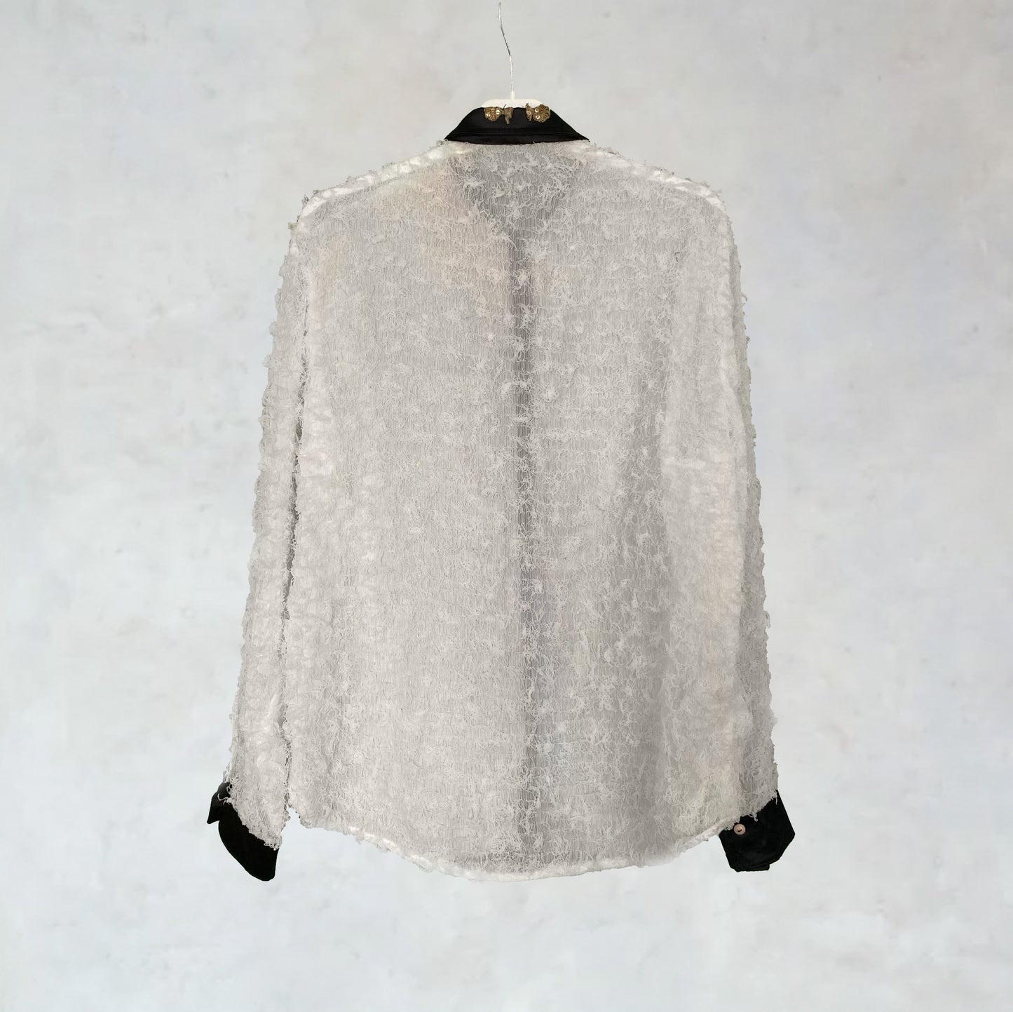 Slightly transparent shirt with ruffles and embroidery