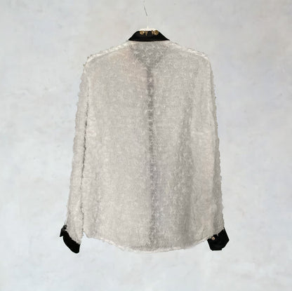 Slightly transparent shirt with ruffles and embroidery