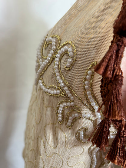 Top with embroidered ornamental motifs